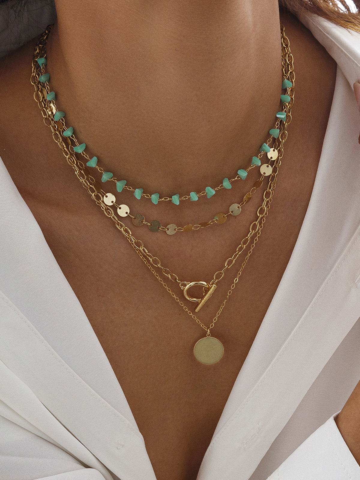 Layered Gold-Chain Necklace With Turquoise Beads And Circular Pendant